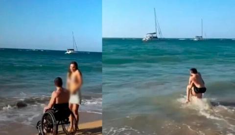 Chica lleva por primera vez a la playa a su novio en silla de ruedas