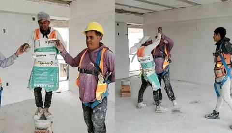 Un grupo de albañiles bailan un vals en honor al ascenso de uno de sus compañeros